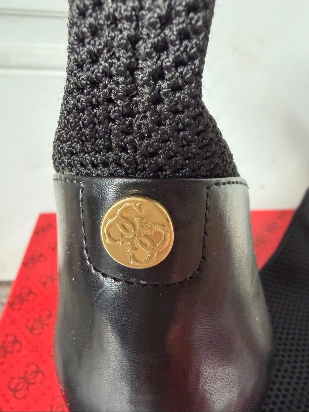 Guess Black Slip-On with Gold Logo Medallion